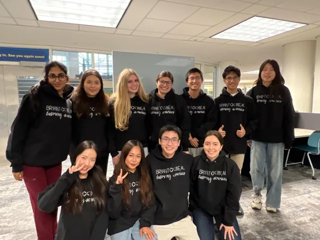 A group of BryantOchem students gathered in their black hoodies.
